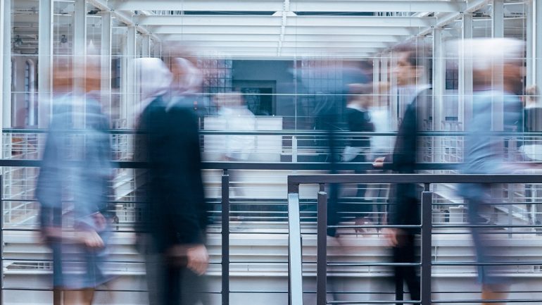 Business people talking in corridor